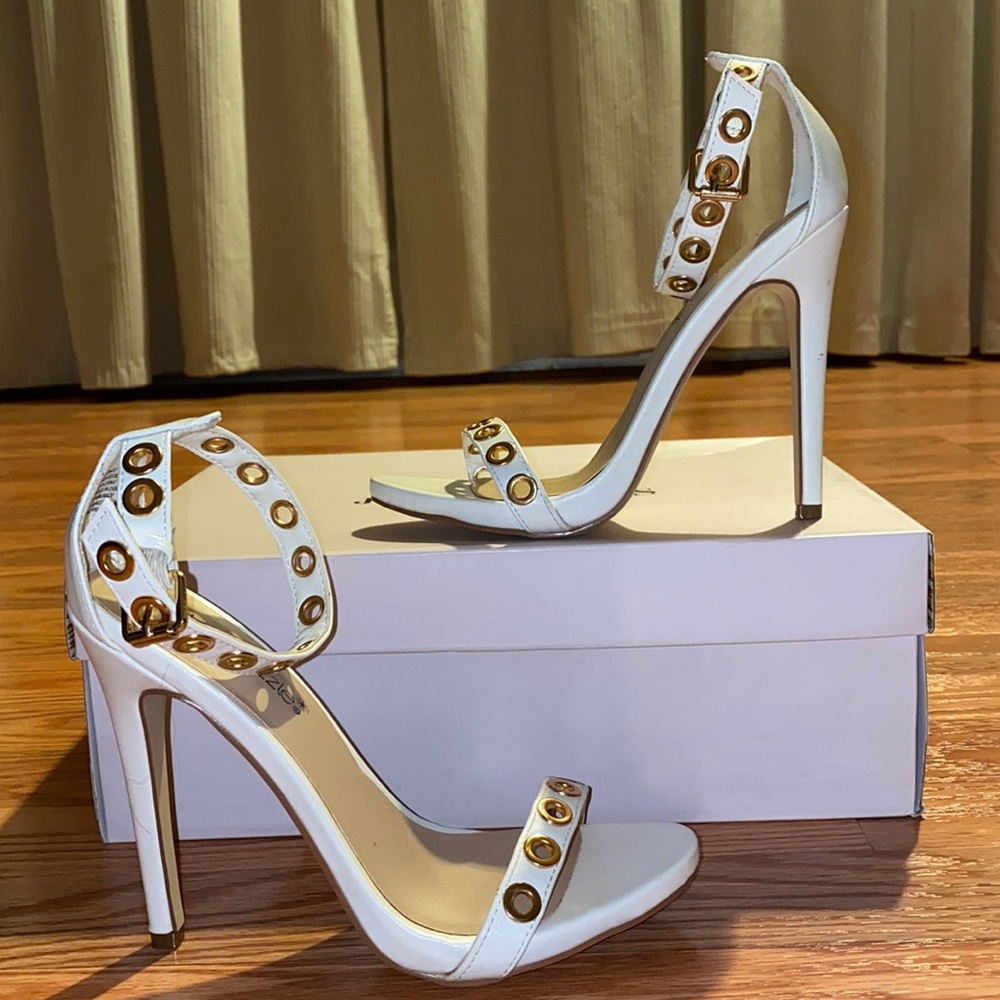 White heels with gold detailing